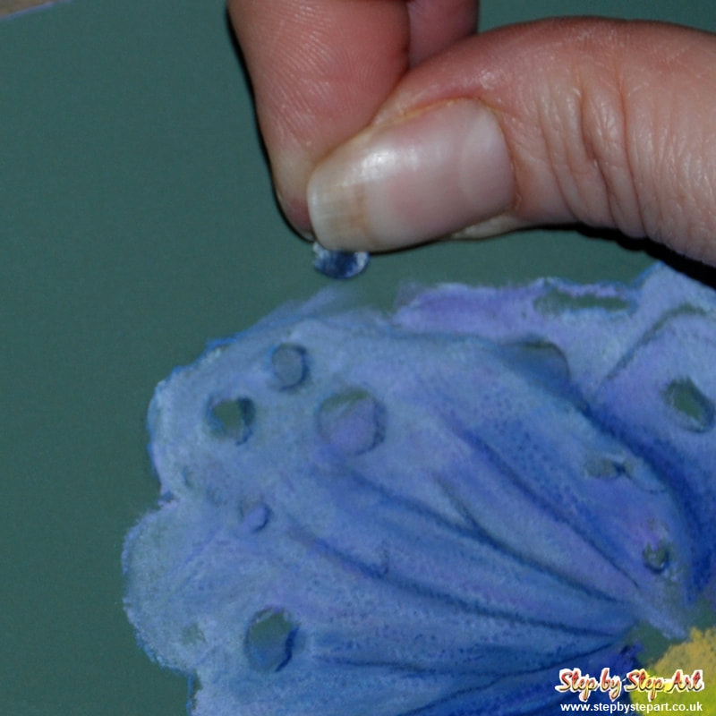 erasing untidy edges on a violet flower using a soft putty rubber