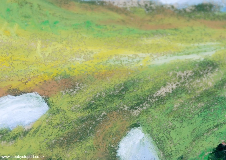 A close up of the surface of the Fisher400 paper with the Sennelier oil pastels of a painting of the Sycamore Gap in Northumberland, UK