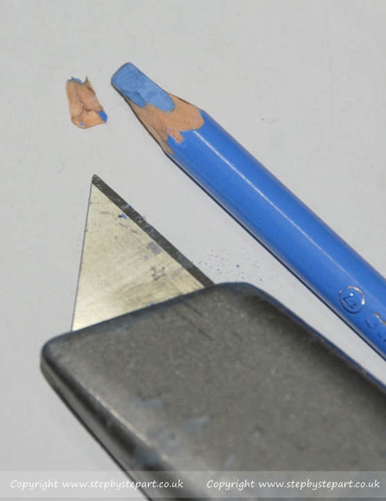 Stabilo CarbOthello blue pastel pencil and  craft knife for sharpening