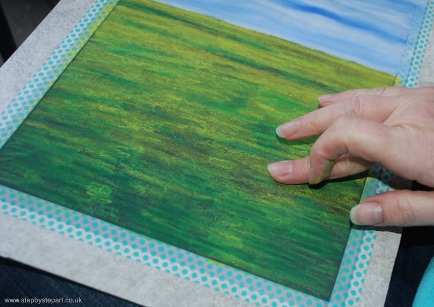 Blending the foundations of an oil pastel painting