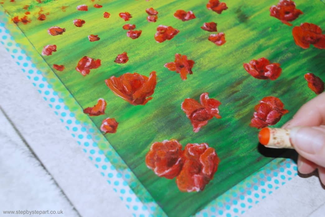 Applying a final layer to the Poppies using the Mandarin Sennelier oil pastel